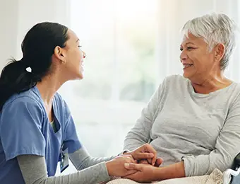 a nurse talking with a resident