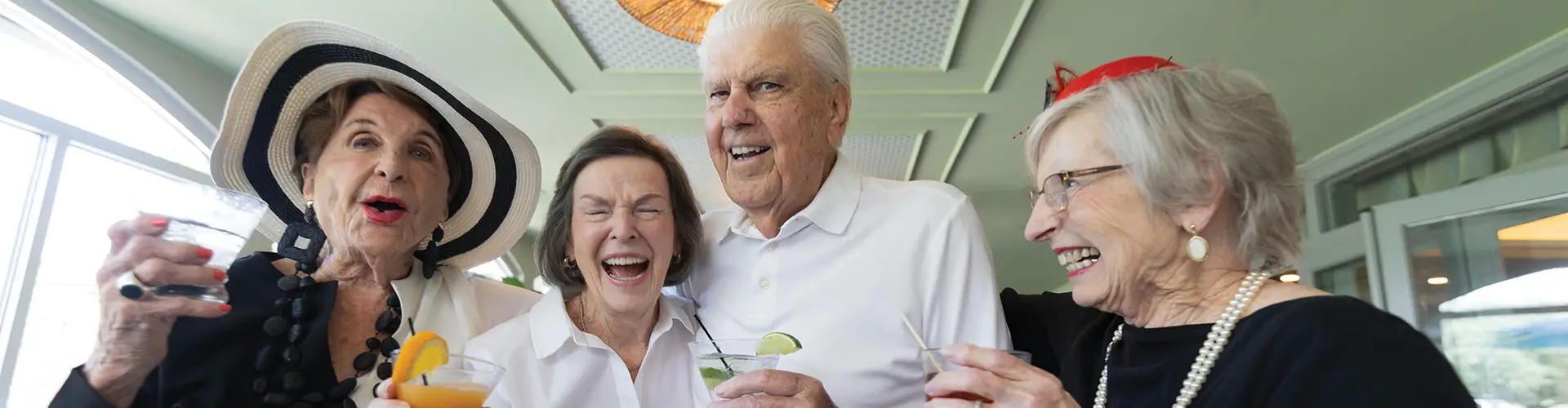 a group of smiling seniors at an event
