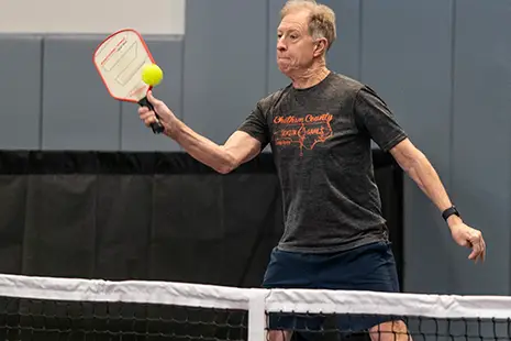 couple playing pickelball