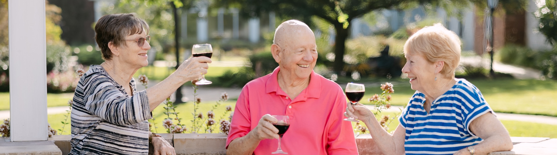 a group of smiling seniors at an event